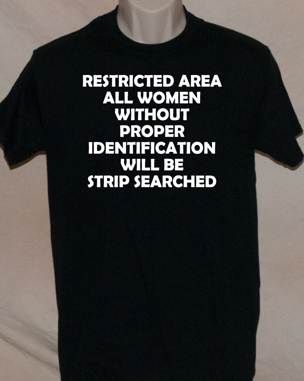1139 RESTRICTED AREA ALL WOMEN WITHOUT PROPER IDENTIFICATION WILL BE STRIP SEARCHED